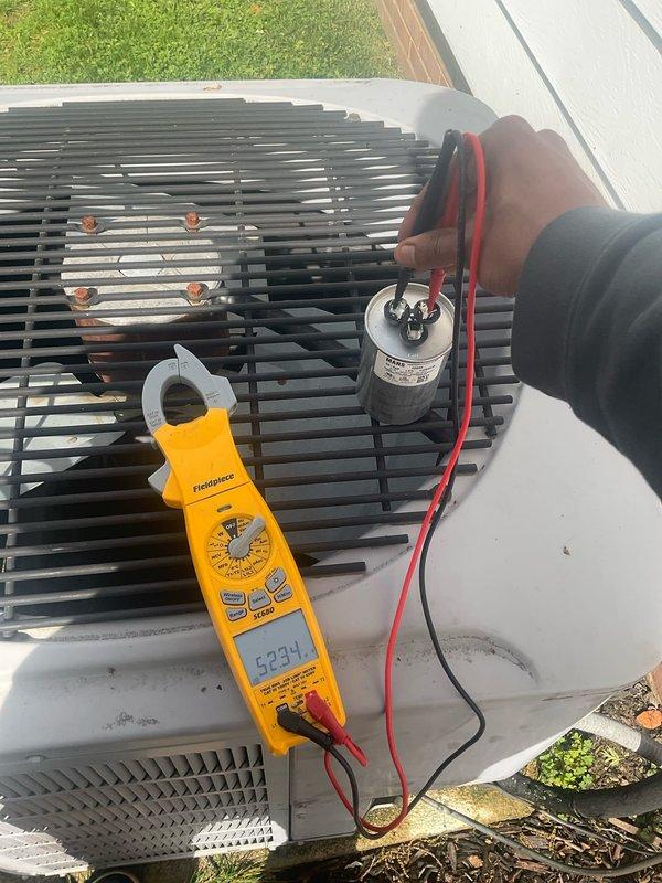 Performed comprehensive cooling system maintenance and diagnostics on outdoor condensing unit. Connected refrigerant manifold gauges to service ports and recorded system pressures and temperatures. Measured superheat at 14.7°F and subcooling at 32.1°F to verify proper refrigerant charge levels. System pressures reading 58.5 PSI on low side and 128.8 PSI, indicating acceptable operating parameters for current ambient conditions.

Conducted electrical diagnostics using digital multimeter to test capacitor functionality. Measured capacitance reading of 623.4 microfarads on run capacitor to ensure proper motor starting and operational efficiency. Verified electrical connections and component integrity throughout the unit. 

Inspected condenser coil fins for cleanliness and airflow restrictions. Evaluated overall unit operation and confirmed system cycling properly. All measurements within manufacturer specifications for optimal cooling performance.