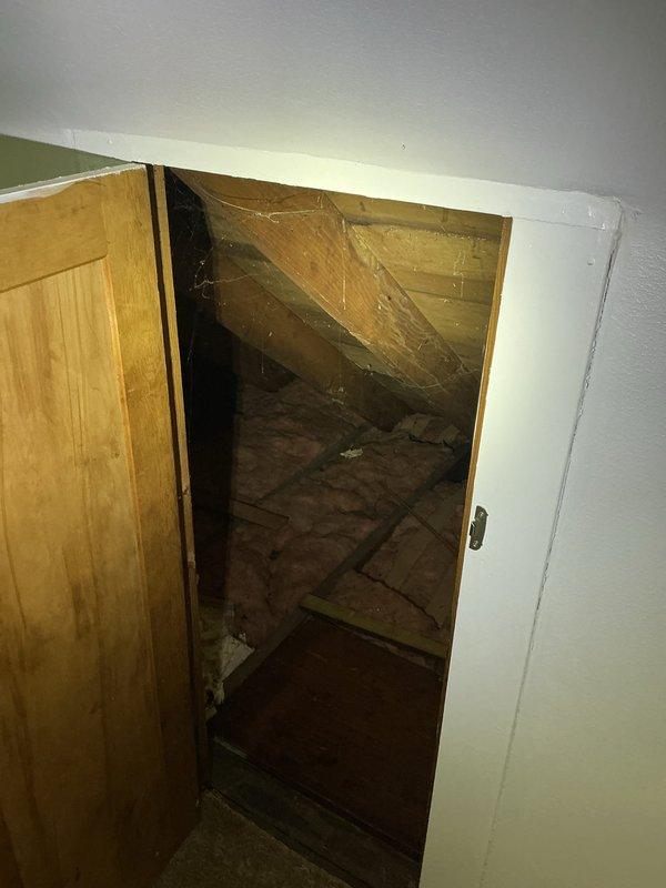 Conducted on-site assessment for mini split installation in upper-floor attic space. Identified existing knob and tube wiring in the area, which presents electrical compatibility concerns that require further evaluation before proceeding with installation. Documented room conditions and existing electrical infrastructure through photographs for review and determination of necessary electrical upgrades to support the mini split system.