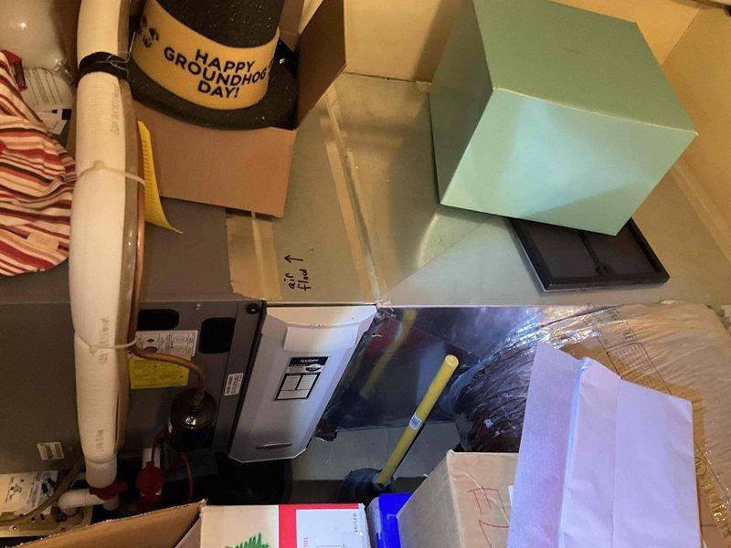 Completed on-site evaluation for residential air conditioning system replacement. Assessed existing outdoor condenser unit positioned adjacent to brick exterior, noting equipment age, condition, and installation parameters. Documented current system specifications, electrical connections, and clearance requirements for replacement unit sizing and installation planning. Photographed equipment nameplate data and surrounding landscape conditions to determine optimal placement and access considerations for new system installation.