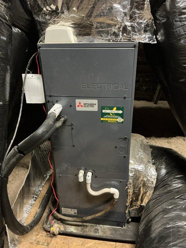 Conducted estimate for mini-split system replacement in residential property. Evaluated existing Mitsubishi Electric air handler unit installed in attic space with connected flexible ductwork and PVC condensate drainage, along with wall-mounted indoor unit in bedroom. Documented current system configuration and captured photos of equipment for proposal preparation.