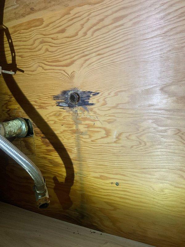 Responded to emergency plumbing call for multiple failed shutoff valves in 1955-era home. Upon arrival, assessed three compression-type shutoff valves with active leaks: one serving downstairs toilet, one at bathroom sink supply line, and one completely broken off at the supply line connection. Previous attempted repairs by occupant had exacerbated damage to valve stems and compression fittings. 

Shut off main water supply to prevent further water intrusion. Documented extensive water damage to subfloor plywood beneath fixtures, showing significant staining and moisture penetration. Removed all three failed compression valves and assessed supply line conditions. The valve that had broken off required additional attention to remove remaining components from the supply line without damaging copper piping.

Installed three new quarter-turn ball valves with appropriate compression fittings to replace failed units. Verified proper shutoff function on all new valves. Restored water supply a