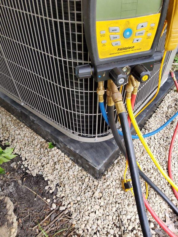 # HVAC System Installation Summary

Completed full air conditioning system installation including new outdoor condensing unit positioned on composite equipment pad with proper gravel base for drainage and stability. Installed new evaporator coil integrated with existing air handler system, with refrigerant lines properly connected and insulated. Established refrigerant charge using manifold gauges and verified system pressures met manufacturer specifications. Installed new electrical disconnect box for outdoor unit with appropriate wire sizing and circuit protection. Mounted new programmable thermostat for enhanced temperature control and system efficiency. All refrigerant connections secured with brass fittings and proper torque specifications. PVC condensate drainage lines configured with appropriate pitch and trap installation. System tested for proper operation including compressor function, airflow verification, and temperature differential measurements. All electrical connections
