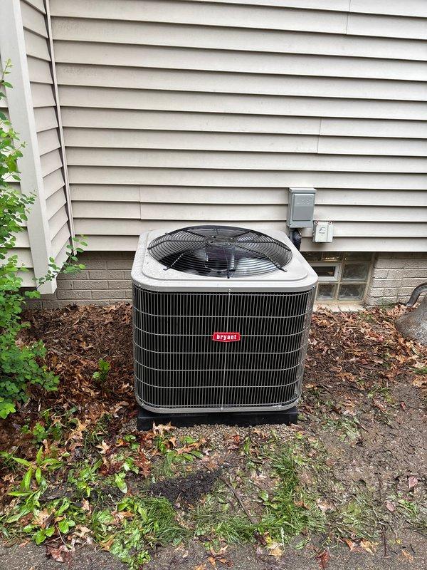 Completed full HVAC system replacement including outdoor condensing unit and evaporator coil. Installed new Bryant air conditioning unit on existing concrete pad, established proper refrigerant connections, and performed vacuum test to verify system integrity. All electrical connections secured, refrigerant lines properly connected, and system tested to manufacturer specifications for optimal cooling performance.