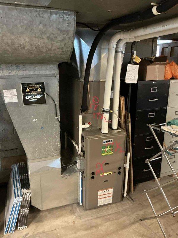 Conducted comprehensive assessment of existing York furnace and air conditioning system for equipment replacement estimate. Documented current HVAC installation including furnace unit, ductwork configuration, electrical components, and PVC venting system in basement utility area. Evaluated equipment condition, system layout, and spatial considerations to provide accurate replacement recommendations and specifications.