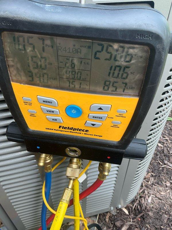 Performed comprehensive air conditioning tune-up on 7-year-old system. Inspected blower wheel assembly and verified proper operation of all components. Connected digital manifold gauges to measure system pressures and temperatures, confirming refrigerant charge levels, superheat, and subcool readings within manufacturer specifications. System operating normally with no deficiencies noted.