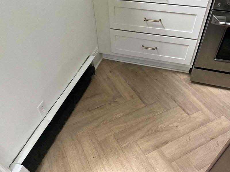 Responded to kitchen radiator heating issue and discovered leaking packing nut on main radiator valve. Access to tighten packing nut was obstructed by recently installed renovation wall, preventing standard repair. Provided estimate for radiator replacement options to resolve the leak and restore proper heating control to the system.