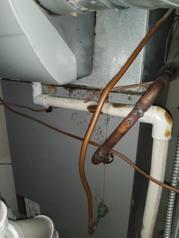 Completed routine cooling system maintenance on 15-year-old air conditioning unit as part of home plan recurring service. Performed comprehensive tune-up including inspection of refrigerant lines, coil conditions, and drainage components. Noted visible age-related wear including copper pipe oxidation, corrosion on metal framework, and accumulated debris in mechanical compartment requiring monitoring for future service intervals.