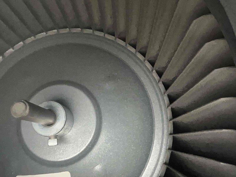 Completed scheduled cooling system maintenance visit. Performed comprehensive inspection of blower assembly and electrical components, documenting significant dust and debris accumulation on fan blades, motor housing, and electrical connections. Identified heavily soiled terminal block and wiring connectors requiring attention, with visible corrosion and contamination throughout equipment interior that could impact system efficiency and reliability.