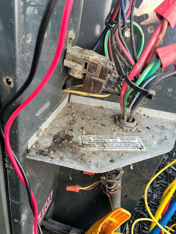Completed scheduled cooling system maintenance visit. Performed comprehensive inspection of blower assembly and electrical components, documenting significant dust and debris accumulation on fan blades, motor housing, and electrical connections. Identified heavily soiled terminal block and wiring connectors requiring attention, with visible corrosion and contamination throughout equipment interior that could impact system efficiency and reliability.