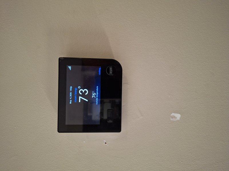 Responded to callback for persistent error code 179 on thermostat following previous sensor and thermostat replacement. Attempted system reboot and diagnostic procedures to clear communication fault between indoor unit and outdoor unit. Verified thermostat display showing 73°F current temperature with 76°F setpoint, inspected outdoor unit components and wiring connections. Code remained active after troubleshooting attempts, indicating potential communication board or wiring issue requiring further diagnosis.