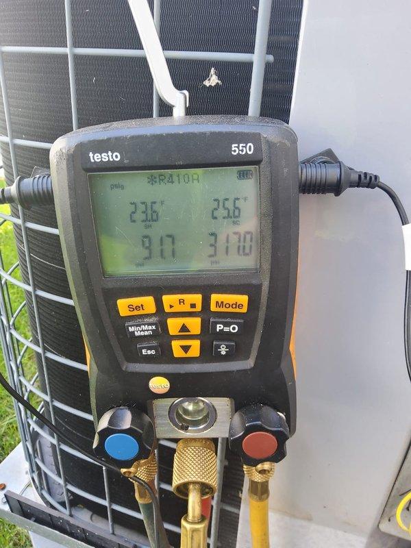 # HVAC Maintenance Service Completed

Performed comprehensive air conditioning maintenance on a cooling system under the MVP prepaid maintenance plan. Conducted thorough system inspection and diagnostics using Testo 550 digital manifold gauges to measure refrigerant pressures and temperatures on the R-410A system.

Recorded operating pressures and temperatures at the outdoor condensing unit, with suction and discharge readings confirming proper refrigerant charge and system performance. Verified superheat and subcooling values were within manufacturer specifications. Inspected condenser coil fins, electrical connections, and refrigerant lines for any signs of wear or damage. System is operating efficiently and ready for continued cooling season operation.
