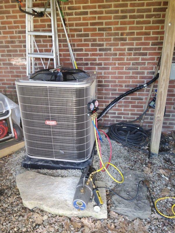 Completed full HVAC system replacement including outdoor condensing unit and indoor evaporator coil. Existing refrigerant line set was inspected, pressure tested, and reused to minimize installation time and cost. New condenser unit was positioned on existing concrete pad with proper clearances maintained. Indoor evaporator coil was installed above furnace/air handler in basement mechanical room, integrated with existing ductwork system. All refrigerant lines were properly connected and insulated. System was evacuated to manufacturer specifications, charged with appropriate refrigerant type and quantity per equipment requirements. Electrical connections were completed at both indoor and outdoor units with proper disconnect switches verified. Condensate drain system was connected and tested for proper operation. System startup performed with all operating pressures and temperatures verified within normal parameters. Airflow across coil confirmed adequate. Unit cycled through complete co