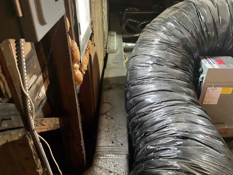 Responded to dispatch for non-operational attic HVAC unit. Upon inspection, assessed existing system located in attic space with flexible ductwork connected to aging equipment. Documented current installation including exterior HVAC unit and building infrastructure. Provided comprehensive estimate for complete system replacement to restore climate control functionality.