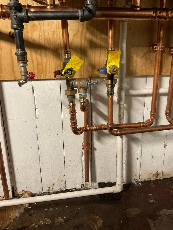 Installed pressure relief valves on hydronic boiler system. Replaced PRVs on copper piping network connected to U.S. Boiler Company heating unit, ensuring proper safety valve operation and system pressure regulation. Work included integration with existing expansion tank and ball valve configuration in the heating distribution system.