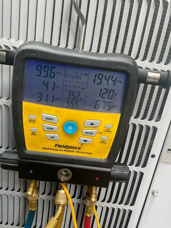 # HVAC Maintenance - Cooling System Service

Performed comprehensive preventative maintenance and tune-up on a Carrier air conditioning unit less than 10 years old located in exterior side yard area. Utilized Fieldpiece SMAN refrigerant manifold and micron gauge to verify system pressures and temperatures, recording readings of 99.6 psig on low side and 194.4 psig on high side with corresponding temperature measurements. Inspected condenser coil fins, refrigerant lines, and electrical connections at outdoor unit. All system parameters tested within normal operating range and unit found to be functioning properly upon completion of seasonal maintenance service.