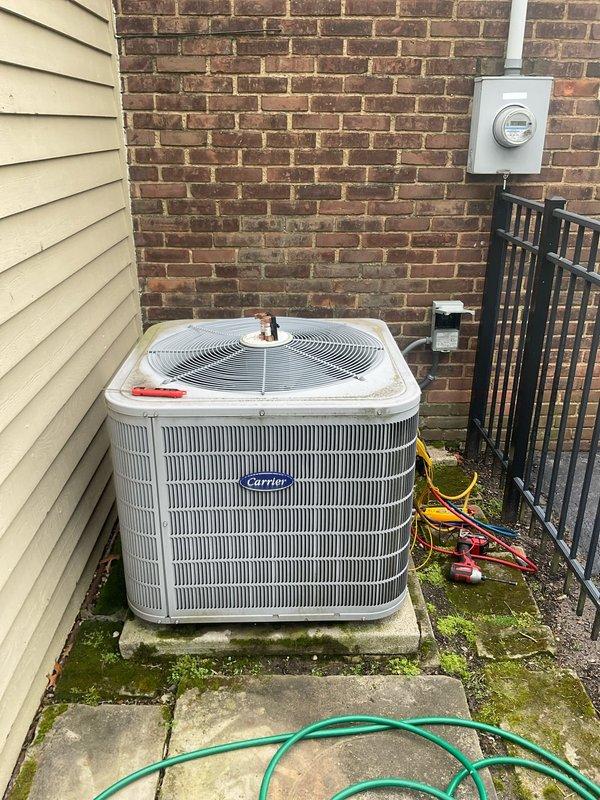 # HVAC Maintenance - Cooling System Service

Performed comprehensive preventative maintenance and tune-up on a Carrier air conditioning unit less than 10 years old located in exterior side yard area. Utilized Fieldpiece SMAN refrigerant manifold and micron gauge to verify system pressures and temperatures, recording readings of 99.6 psig on low side and 194.4 psig on high side with corresponding temperature measurements. Inspected condenser coil fins, refrigerant lines, and electrical connections at outdoor unit. All system parameters tested within normal operating range and unit found to be functioning properly upon completion of seasonal maintenance service.