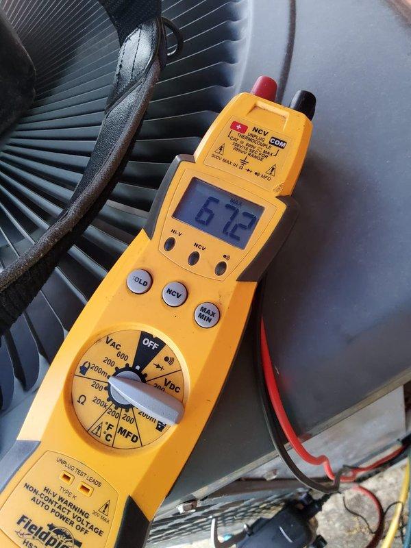 Performed comprehensive cooling system maintenance on backyard R-410A air conditioning unit. Utilized Testo 550 digital manifold to verify refrigerant pressures and temperatures, recording 280 psi high-side and 179.4 psi low-side pressures with 143°F discharge and 80°F suction temperatures, confirming system operating within normal parameters. Conducted electrical diagnostics with Fieldpiece meter, measuring 6.73 reading to verify proper component function. Inspected condenser coil fins for cleanliness and airflow efficiency, documented equipment condition with photos for service records.