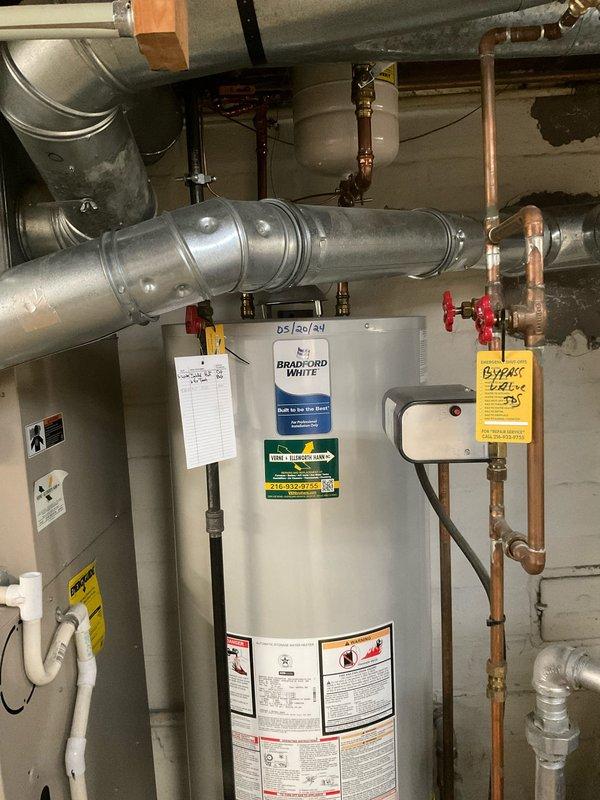 Performed scheduled maintenance on Bradford White water heater in basement utility room. Inspected unit operation, tested temperature and pressure relief valve, checked all copper piping connections and shut-off valves, and verified proper functioning of expansion tank. Documented equipment condition with photos showing all mechanical connections, ductwork, and plumbing infrastructure in satisfactory working order.