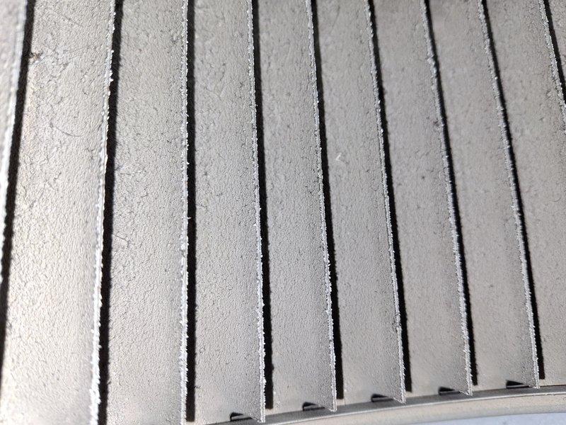 Performed scheduled cooling system tune-up on a 10-year-old air conditioning unit for a home plan member. Upon inspection, discovered evaporator coil completely covered with heavy frost and ice buildup, indicating a system malfunction. Documented the frozen coil condition with photographs showing extensive crystalline ice formation across all coil fins. Measured and recorded superheat reading of 53.5°F using digital refrigerant analyzer, confirming improper refrigerant charge or restricted airflow causing the freeze-up condition. The system was operational but running in a compromised state. Identified this as a critical issue requiring immediate attention to prevent compressor damage and system failure. Recommended allowing coil to thaw completely before further diagnostics to determine root cause, which could include low refrigerant charge due to leak, restricted airflow from dirty filter or blocked return, failed blower motor, or malfunctioning thermostatic expansion valve. System r