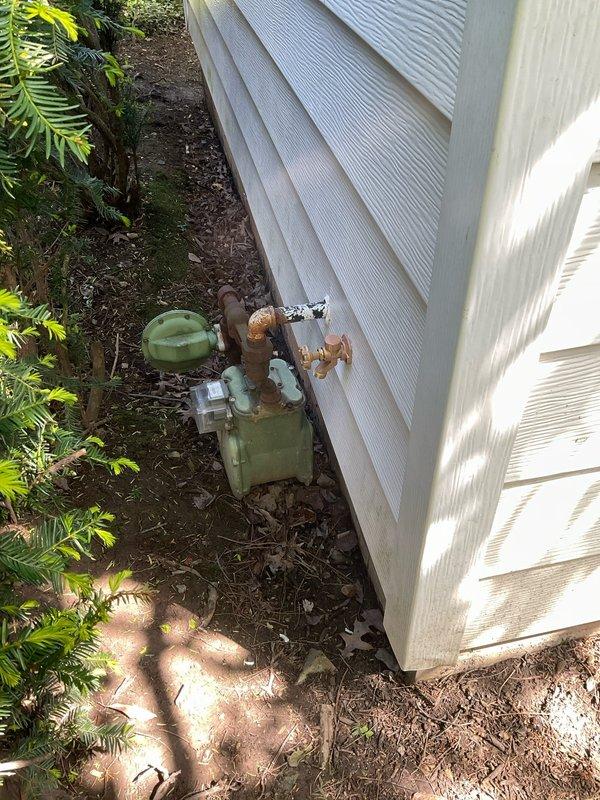 Installed exterior hose spigot on building exterior wall, utilizing either 4-inch or 6-inch frost-free sillcock as specified. Connected new spigot to existing water supply lines in basement, installing shut-off valves for isolation and future maintenance access. Work scheduled as second appointment to complete installation.