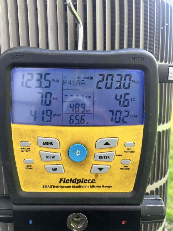 Performed comprehensive maintenance on 3-year-old air conditioning system including inspection of outdoor condensing unit and verification of system operation. Measured and recorded refrigerant pressures and temperatures using manifold gauge set, confirming R-410A charge levels with superheat at 70°F and subcooling at 46°F within manufacturer specifications. Replaced humidifier water panels as requested and completed all standard preventative maintenance procedures to ensure optimal system performance for upcoming home inspection.