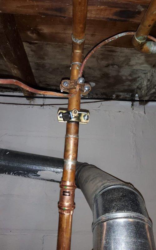 Removed existing Aprilaire whole-house humidifier system from HVAC installation. Disconnected water supply line from copper plumbing assembly and capped connection point. Removed humidifier unit from furnace cabinet and associated mounting hardware. Sealed ductwork penetrations where humidifier was previously installed to prevent air leakage and maintain system efficiency. Inspected surrounding ductwork connections and HVAC equipment to ensure proper operation following removal. All components removed and area left clean and secure.