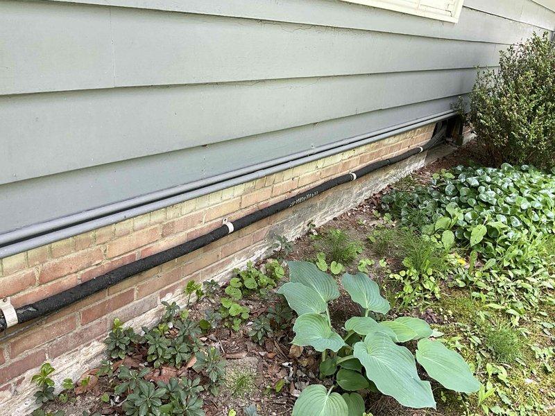 Conducted comprehensive estimate for complete HVAC system replacement including gas furnace and air conditioning unit. Evaluated existing Trane XL 80 furnace installation, associated ductwork infrastructure, refrigerant line routing along exterior foundation, and condensate drainage system. Documented current equipment configuration, outdoor condenser location adjacent to foundation landscaping, and mechanical room layout to provide accurate replacement specifications and installation requirements.