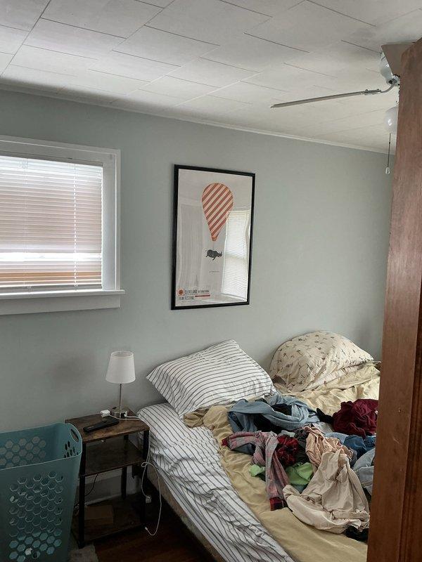 Conducted follow-up site assessment for mini split installation estimate in residential bedroom. Documented room layout, existing heating infrastructure including baseboard radiator, ceiling configuration with drop tile panels, and electrical conduit routing. Evaluated optimal placement locations for indoor air handler unit and assessed wall penetration requirements for refrigerant line set routing to exterior condensing unit.