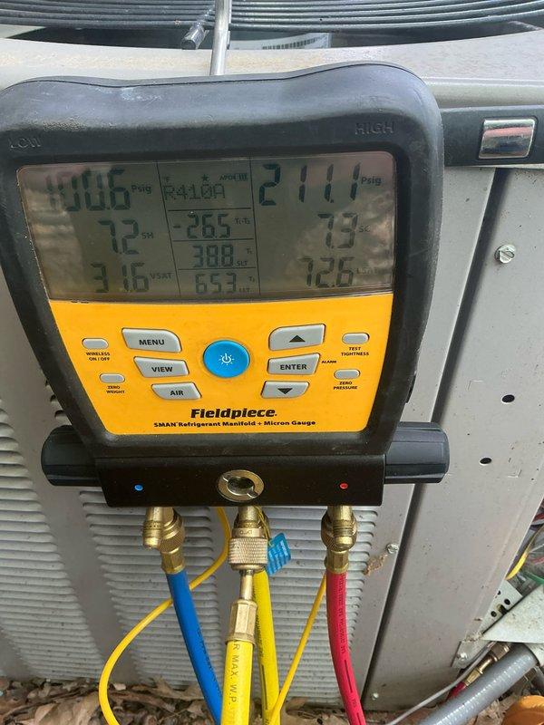 Completed routine cooling system maintenance on a 12-year-old air conditioning unit, including comprehensive inspection of the blower motor assembly and verification of refrigerant pressures and system temperatures. All measured values were within manufacturer specifications, with operating pressures of 906 PSIG on the high side and 271.0 PSIG on the low side, confirming proper system charge and performance for continued efficient operation.