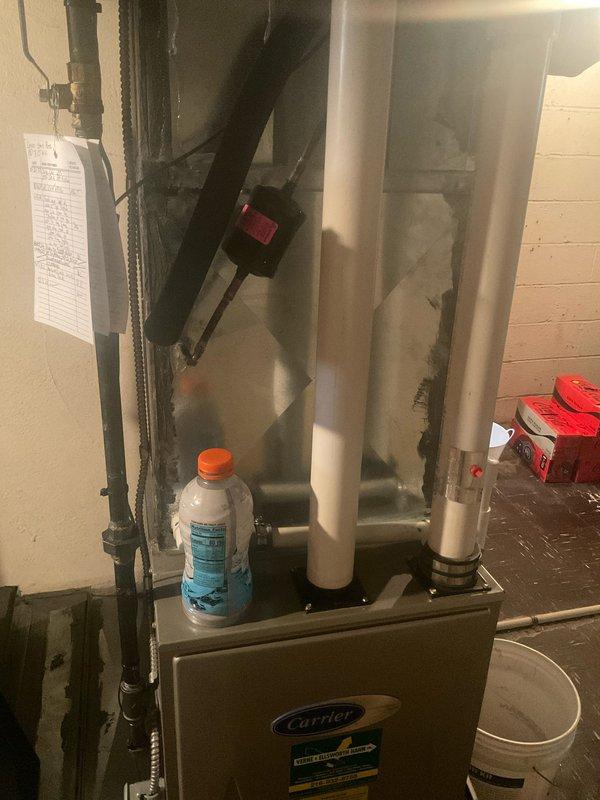 Completed routine air conditioning tune-up on Carrier split system with no reported issues. Performed comprehensive maintenance inspection of indoor air handler unit and outdoor condensing unit, verified all electrical connections and specifications per manufacturer nameplate (Model 1718X76824, 208-230V), checked refrigerant pressures, and confirmed system operational status. All components found operating within normal parameters.