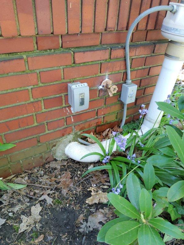 Responded to emergency call for frozen anti-frost spigot installed the previous year with suspected burst pipes. Upon arrival, inspected exterior spigot mounted on brick wall and accessed crawl space to evaluate copper supply line condition. Found compromised pipe insulation and deteriorated vapor barrier mesh in underfloor area. Assessed brass fittings and copper piping for freeze damage, verified structural integrity of plumbing connections, and documented conditions of both exterior spigot installation point and interior supply line routing through floor joists.