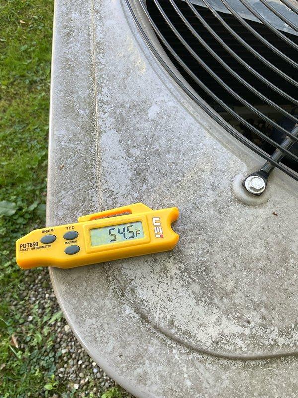 Performed preventative maintenance on two residential cooling systems: one outdoor condenser unit located in the backyard and one air handler unit installed in the attic space. Conducted temperature diagnostics on the outdoor unit, recording surface temperature readings of 54.5°F on the condenser pad. Inspected condenser coil fins, concrete pad condition, and overall exterior unit operation. In the attic, evaluated the air handler system including flexible ductwork connections, insulated refrigerant line sets, PVC condensate drainage system, and auxiliary condensate pump assembly. Verified proper installation of all components, checked insulation integrity on refrigerant lines, and confirmed condensate removal systems were functioning correctly. Both systems appeared operational with all major components accessible for routine service.