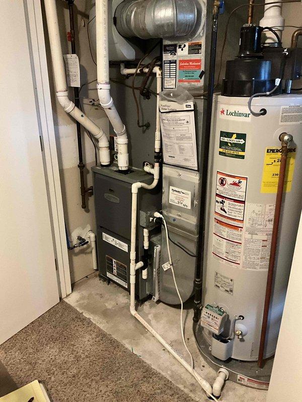 Responded to service call for HVAC estimate due to biological growth requiring remediation work. Assessed existing Armstrong Air furnace installation in residential utility room and determined unit requires removal to facilitate cleaning of growth contamination. Documented current system configuration including furnace, ductwork, PVC venting, and associated mechanical components. Provided replacement estimate for new furnace system to be installed following completion of remediation work by restoration contractor.