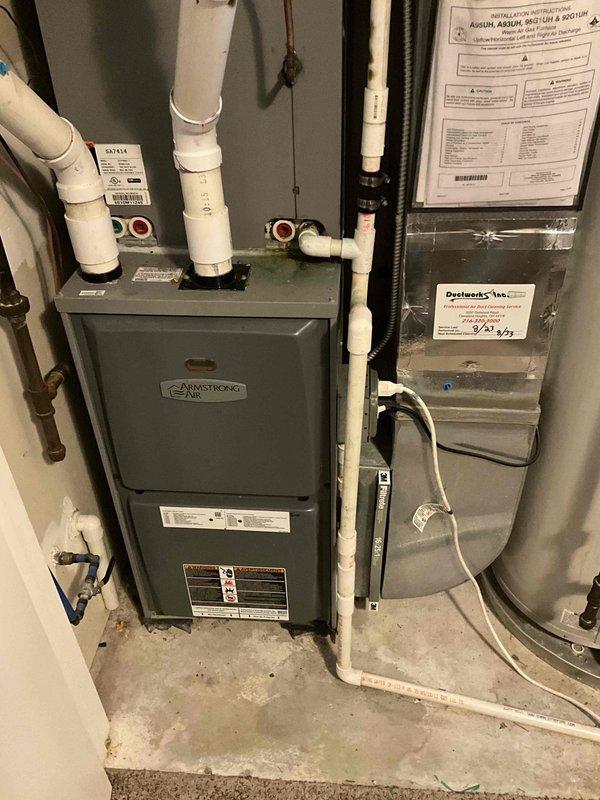 Responded to service call for HVAC estimate due to biological growth requiring remediation work. Assessed existing Armstrong Air furnace installation in residential utility room and determined unit requires removal to facilitate cleaning of growth contamination. Documented current system configuration including furnace, ductwork, PVC venting, and associated mechanical components. Provided replacement estimate for new furnace system to be installed following completion of remediation work by restoration contractor.