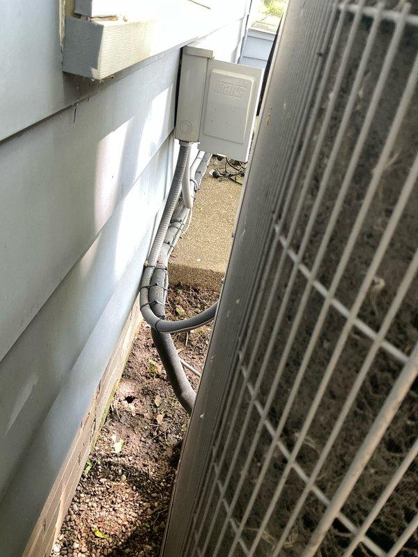 Completed scheduled cooling maintenance on a one-year-old air conditioning system. Upon arrival, performed comprehensive inspection of outdoor condenser unit, which revealed significant accumulation of dust, dirt, and debris trapped between condenser fins and coils. Cleaned condenser coils to restore proper airflow and heat transfer efficiency, removing particulate buildup that had collected during the unit's first year of operation. Inspected refrigerant lines, electrical connections, and all accessible components in the side yard installation area. System tested and confirmed operating within normal parameters following maintenance completion.