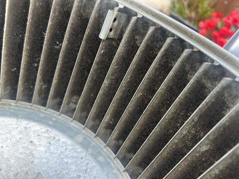 Performed routine maintenance on a 7+ year old air conditioning system. Inspected condenser coil and evaporator coil, both showing heavy accumulation of dirt, dust, and debris restricting airflow. Documented coil condition with photos showing significant buildup on fin surfaces requiring cleaning to restore proper system efficiency and performance.