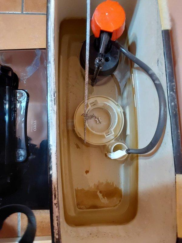 Responded to service call for clogged sink drain and low hot water pressure. Upon inspection, discovered significant mineral buildup and sediment accumulation in plumbing fixtures. Cleared blockage from sink drain line using appropriate drain cleaning equipment. Identified corroded internal tank components and discolored water indicating mineral deposits affecting water flow. Addressed hot water pressure issue by flushing sediment from supply lines and inspecting aerators. Restored proper drainage to sink and improved hot water pressure to normal operating levels.