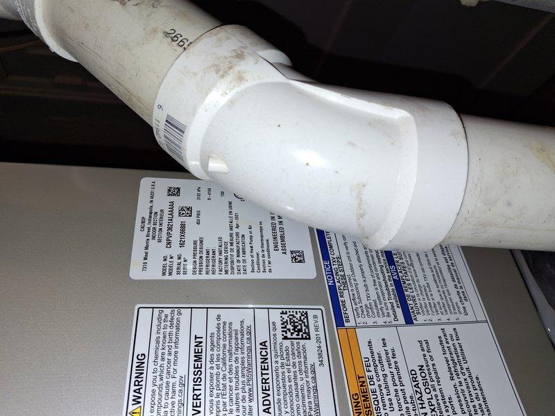 Completed air conditioning tune-up on four-year-old system. Upon inspection, discovered evaporator coil experiencing frost buildup, indicating potential airflow restriction or refrigerant issue. Inspected condensate drain line and system components, documented equipment condition with photos. Unit was operational at time of service but frost accumulation on coil fins requires monitoring for underlying issues such as dirty filter, low refrigerant charge, or restricted airflow that could impact system performance if left unaddressed.