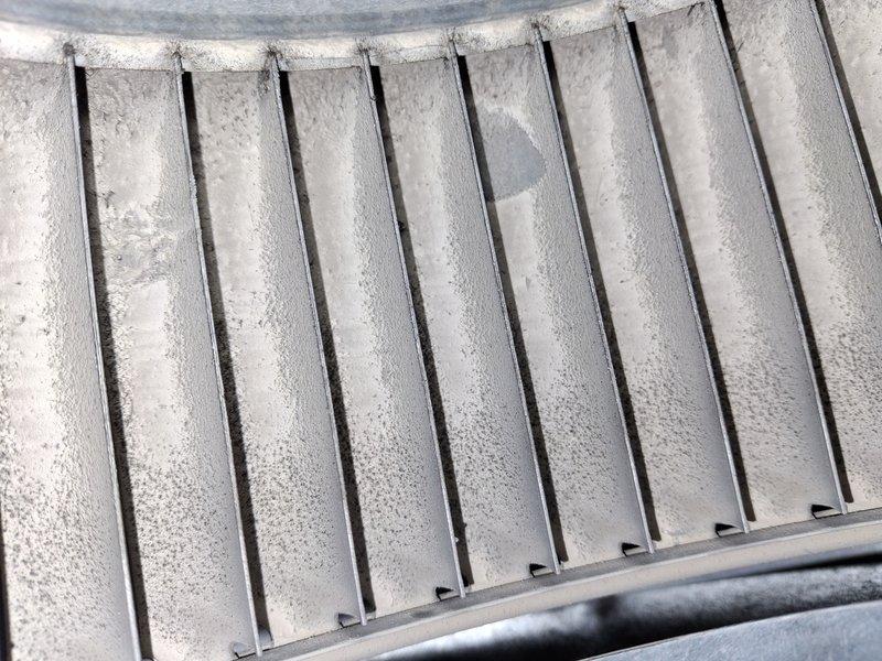Completed air conditioning tune-up on four-year-old system. Upon inspection, discovered evaporator coil experiencing frost buildup, indicating potential airflow restriction or refrigerant issue. Inspected condensate drain line and system components, documented equipment condition with photos. Unit was operational at time of service but frost accumulation on coil fins requires monitoring for underlying issues such as dirty filter, low refrigerant charge, or restricted airflow that could impact system performance if left unaddressed.