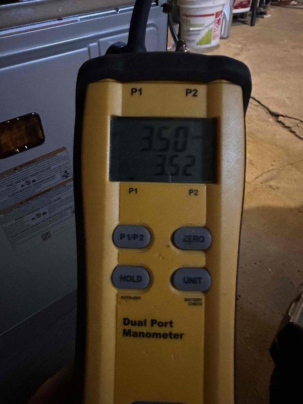 Completed installation of new furnace system and thermostat replacement. Performed comprehensive pressure diagnostics using dual port manometer to verify proper gas pressure readings and system operation, confirming P1 and P2 port measurements met manufacturer specifications for optimal furnace performance and safety compliance.