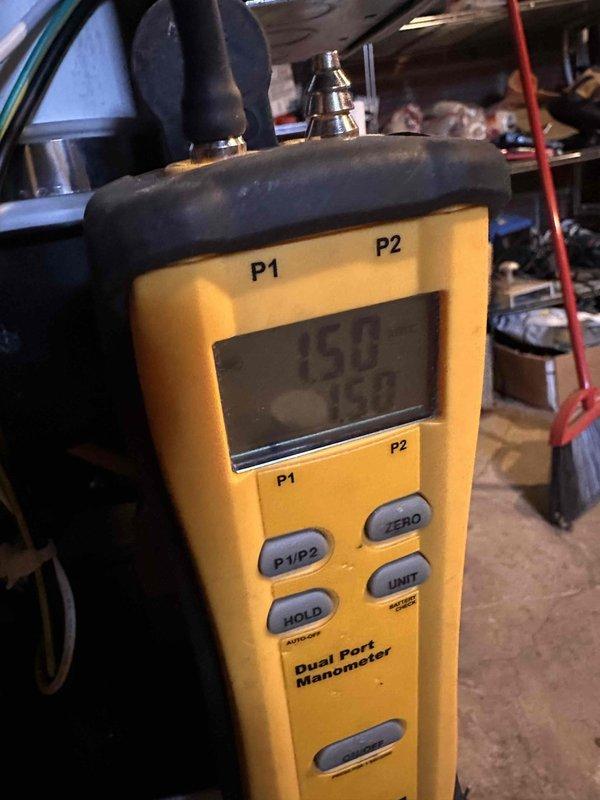 Completed installation of new furnace system and thermostat replacement. Performed comprehensive pressure diagnostics using dual port manometer to verify proper gas pressure readings and system operation, confirming P1 and P2 port measurements met manufacturer specifications for optimal furnace performance and safety compliance.