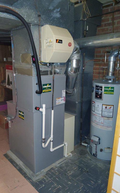 Completed comprehensive cooling system maintenance on 15-year-old residential Bryant HVAC unit located in basement with outdoor condenser fan. Performed standard inspection protocol including filter replacement, coil cleaning, refrigerant level verification, electrical connection testing, and thermostat calibration to ensure optimal system performance for the cooling season.