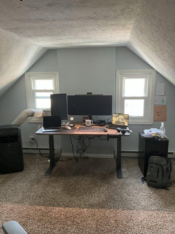 Conducted estimate for potential AC replacement in residential property with existing furnace and water heater system located in basement mechanical room. Evaluated current HVAC system capacity and determined unit may be undersized for the home's cooling requirements, including converted attic office space with multiple electronic devices generating additional heat load. Documented existing equipment configuration and ductwork layout with photographs for replacement proposal preparation.