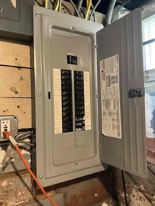 Conducted on-site evaluation for mini split installation in kitchen area with potential expansion to additional zones. Assessed existing electrical panel capacity and available breaker spaces to determine power requirements for proposed ductless system. Evaluated installation location near kitchen window area and identified suitable routing paths for refrigerant lines and electrical connections. Documented current electrical infrastructure and potential mounting locations for indoor and outdoor units. Provided customer with equipment options and installation scope for single or multi-zone mini split configuration.