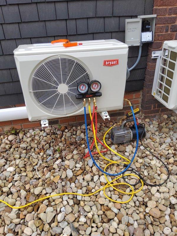Performed AC system startup on Bryant outdoor condensing unit. Connected manifold gauges and refrigerant service lines to verify system pressures and refrigerant charge levels. Confirmed proper system operation, pressures within manufacturer specifications, and unit cycling correctly upon completion of startup procedures.
