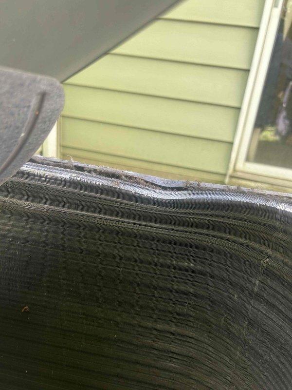 Performed preventative maintenance on 7-year-old residential air conditioning system. Inspected evaporator and condenser coils, noting significant accumulation of dirt, dust, and debris throughout the fin surfaces which can reduce heat transfer efficiency and system performance. Documented coil condition with photos showing heavy buildup between metal fins and on exterior surfaces, typical of outdoor equipment exposed to environmental elements without recent cleaning.