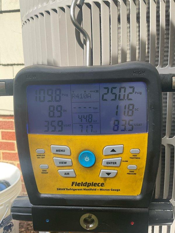 Performed preventive maintenance on three cooling systems including two standard split systems and one mini-split unit located in the basement, attic, and first-floor office. Conducted comprehensive system diagnostics using refrigerant manifold gauges, recording operating pressures of 409.8 psig high-side and 250.2 psig low-side with temperatures at 89°F and 118°F on the outdoor Bryant condenser unit. Inspected heat exchanger coils, verified refrigerant line connections, and confirmed all systems operating within manufacturer specifications for the upcoming cooling season.