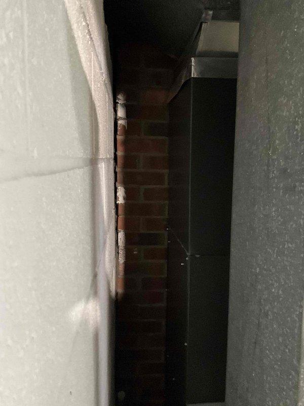 Conducted comprehensive assessment of 14-year-old residential HVAC system to provide replacement estimate. Inspected existing Goodman furnace and air handler unit located in basement mechanical space against exposed brick wall. Evaluated current equipment condition, ductwork configuration, PVC condensate drain lines, electrical connections, and overall system layout. Documented equipment specifications, model information, and installation constraints including confined workspace between masonry walls. Photographed existing system components and utility connections to develop accurate replacement proposal. Provided homeowner with detailed equipment replacement recommendations and scheduling options for complete system changeover.