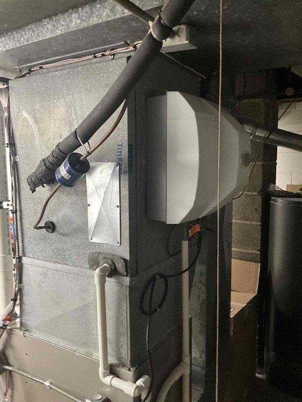 Conducted comprehensive assessment of residential HVAC system for air conditioning replacement estimate following ice damage to existing equipment. Documented current system configuration including Bryant furnace installation with PVC venting, associated ductwork, and air handler components. Evaluated mechanical room layout and existing infrastructure to determine replacement requirements and compatibility with new AC unit installation.