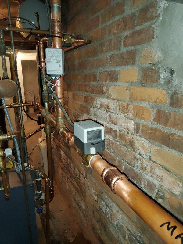 Replaced three defective zone valves on the hydronic heating system and installed a new zone control panel to properly manage heat distribution throughout the home. Drained the entire system, completed the valve and panel installation with new copper piping connections and brass fittings, refilled the system, and performed a complete purge procedure to eliminate all air from the lines, ensuring optimal circulation and efficient operation across all heating zones.